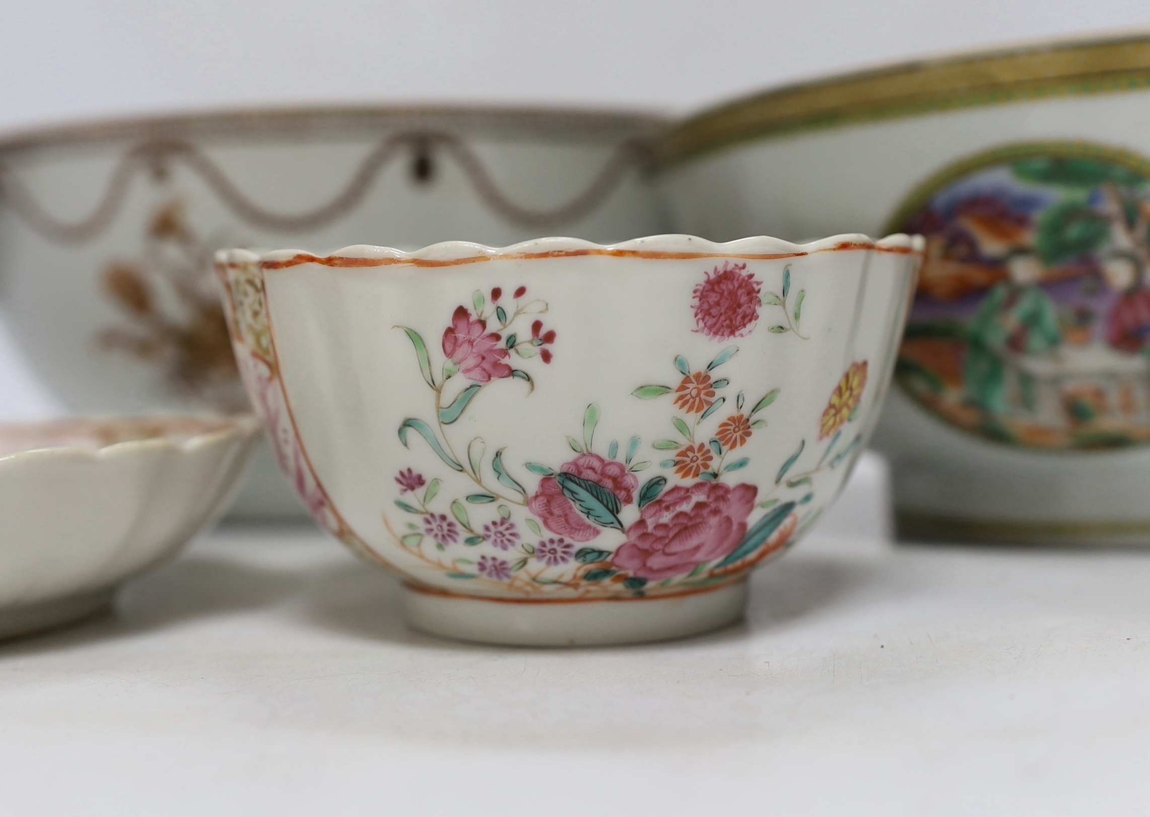 A Chinese famille rose bowl and dish and two similar bowls, all Qianlong period, largest diameter 23cm